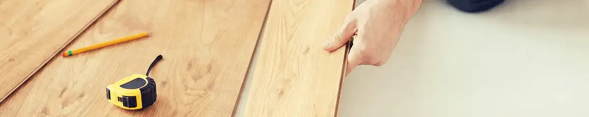A professional installing wood flooring in Bradenton, FL
