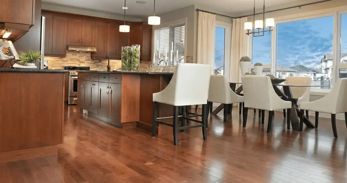 A modern kitchen with professionally installed wood flooring in Bradenton, FL