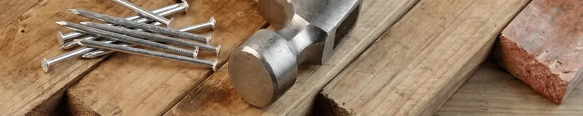 Hammer and nails on hardwood flooring boards in Bradenton, FL