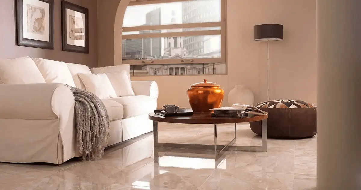 Modern living room with professionally installed marble flooring, a beige sofa, coffee table in Bradenton, FL
