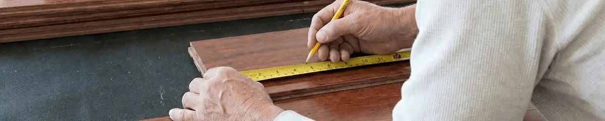 A professional installing wood flooring in Bradenton, FL